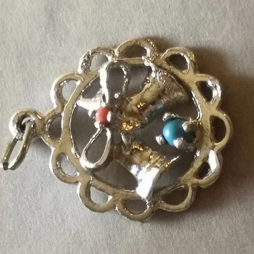 Bow and bell pendant